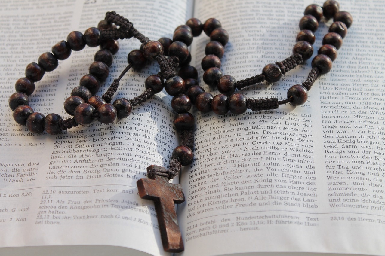 a book, bible, cross